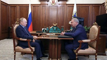 بوتين مجتمعا ببوريسوف في الكرملين بموسكو (26 تموز 2022، أ ف ب). 