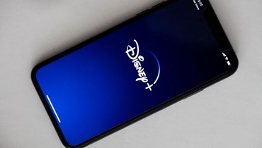 شاشة هاتف تظهر شعار ديزني (أ ف ب). 