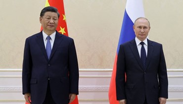 لقاء بين الرئيسين الروسي والصيني في أوزبكستان (أ ف ب).