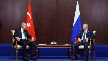 لقاء بين بوتين وإردوغان في كازاخستان (أ ف ب).