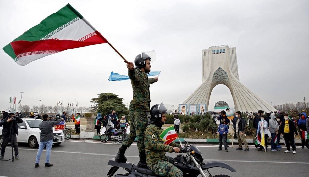 إيرانيون يحتفلون بذكرى انتصار القورة الإسلامية في طهران (تعبيرية- أ ف ب).