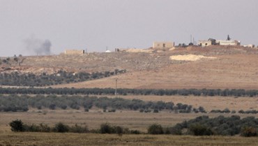 الجزء الشمالي من محافظة حلب حيث  الدخان يتصاعد من المناطق التي يسيطر عليها الأكراد وهي تقصف من قبل مقاتلين مدعومين من تركيا (أ ف ب). 