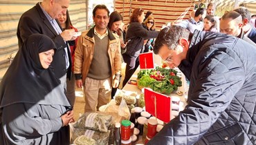 وزير الزراعة خلال رعايته افتتاح "يوم المونة" في باحة قلعة بعلبك الأثرية. 