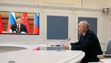 بوتين يعقد اجتماعا بشي عبر الفيديو في الكرملين في موسكو (30 ك1 2022، أ ف ب).