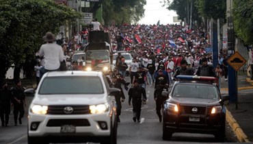 أنصار لأورتيغا يشاركون في مسيرة مؤيدة للحكومة في ماناغوا (11 شباط 2023، ا ف ب). 