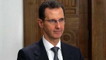 الأسد خلال القائه خطاباً متلفزاً في دمشق (16 شباط 2023، أ ف ب). 