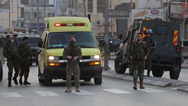  قوات الأمن الإسرائيلية في بلدة حوارة (أ ف ب).