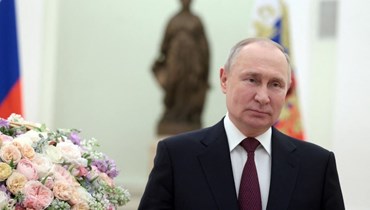 بوتين خلال القائه كلمة في موسكو بمناسبة يوم المرأة العالمي (8 آذار 2023- أ ف ب). 
