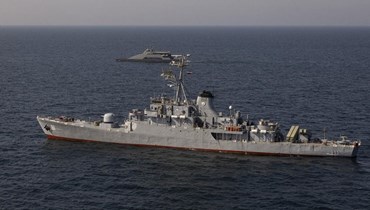 سفن حربية خلال مناورة عسكرية مشتركة بين إيران وروسيا والصين في خليج عمان (أ ف ب). 