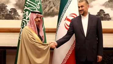 وزير الخارجية السعودي والإيراني في بيجينغ (أ ف ب).