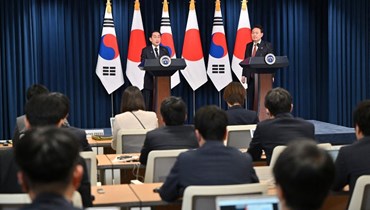 رئيس كوريا الجنوبية ورئيس وزراء اليابان. (أ ف ب)