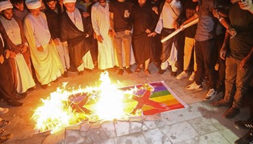 تنديد عراقي بإحراق القرآن في السويد (أ ف ب).