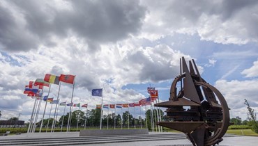 أعلام دول الناتو في بروكسيل - "أ ب"