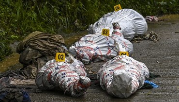 جثث بعض ضحايا انزلاقات التربة  في كولومبيا (أ ف ب). 