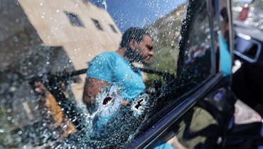  سيارة اخترقتها طلقات نارية قُتل فيها فلسطيني في الضفة الغربية (أ ف ب).