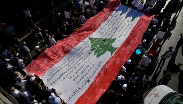 العلم اللبناني في الذكرى الثالثة لانفجار المرفأ (نبيل اسماعيل).
