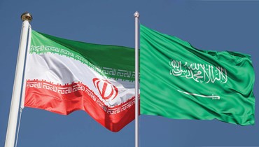 العلم السعودي والإيراني.