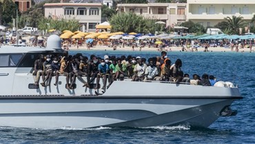 مهاجرون جدد يصلون الى ميناء جزيرة لامبيدوسا الإيطالية (15 ايلول 2023، أ ف ب).