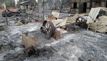 صورة ارشيفية- منازل احترقت في قرية موي تون في بلدة بالي بمنطقة ساجاينغ  في بورما (1 شباط 2022، أ ب). 