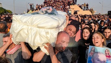جنازة ضحايا حريق قاعة الزفاف في قرقوش الشمالية (27 ايلول 2023، ا ف ب). 