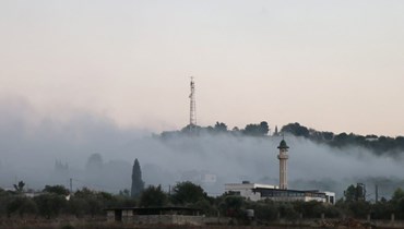 دخان يتصاعد بعد قصف إسرائيلي على الضهيرة (أ ف ب).  