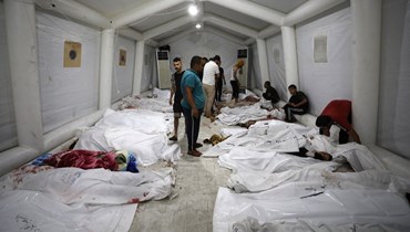 مئات الشهداء في قصف إسرائيلي وحشي على مستشفى الأهلي المعمداني (أ ف ب).