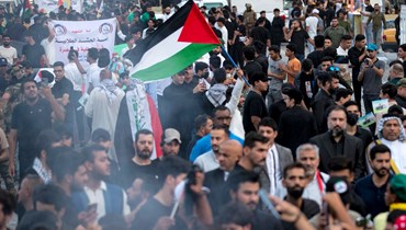 خلال تظاهرة تضامنية مع الشعب الفلسطيني في غزة، في مدينة البصرة جنوب العراق (20 ت1 2023، أ ف ب). 