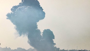 صورة ملتقطة من سديروت جنوب إسرائيل، تظهر الدخان يتصاعد فوق شمال قطاع غزة بعد غارة إسرائيلية (25 ت1 2023ـ أ ف ب).
