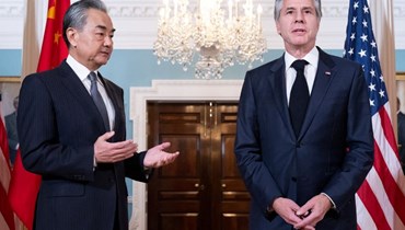 وزيرا الخارجية الأميركي والصيني في واشنطن (أ ف ب).