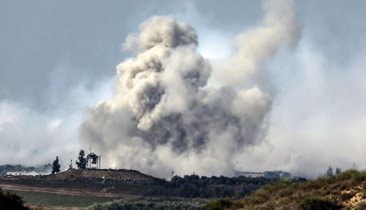 دخان يتصاعد خلال قصف عسكري إسرائيلي على شمال قطاع غزة (15 ت2 2023، أ ف ب).