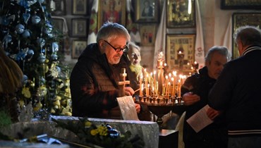 احتفال بقداس الميلاد في أوكرانيا (أ ف ب).