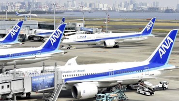 طائرات تابعة لخطوط نيبون الجوية توقفت في مطار هانيدا بطوكيو (31 آذار 2022، أ ب). 	