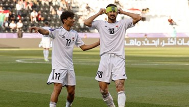 لاعبو العراق. (أ ف ب)