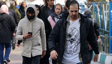 إيرانيّون في أحد شوارع طهران (أ ف ب).