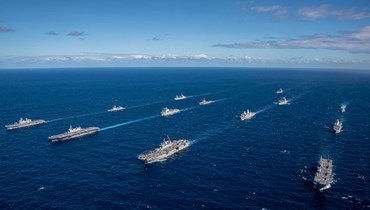 سفن حربية أميركية وأوسترالية ويابانية وكورية جنوبية خلال تدريبات مشتركة في المحيط الهادئ (أ ف ب). 