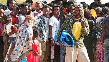صورة ارشيفية- لاجئون إثيوبيون في مخيم أم راكوبة ببلدة القضارف شرق الخرطوم (15 ت2 2020، أ ف ب).