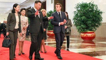 الرئيس الفرنسي إيمانويل ماكرون ونظيره الصيني شي جينبينغ.
