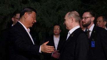 لقاء بين الرئيسين الصيني والروسي (أ ف ب).