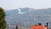 دخان القصف الفسفوري على بلدة عديسة من موقع مسكاف عام الإسرائيلي (أحمد منتش).